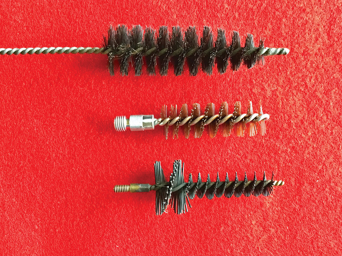 The hardest area to clean on a Sharps is the area just ahead of the chamber sleeve (aka: bouching). This cavity gets full of crud that can cause severe rust, so here are some examples of brushes you can use to clean that area. On top is a bottle brush, in the center is a nylon shotgun brush and on the bottom is a nylon chamber brush for an AR-10 in .308 caliber, which I like the best. I would not recommend bronze brushes for this purpose.